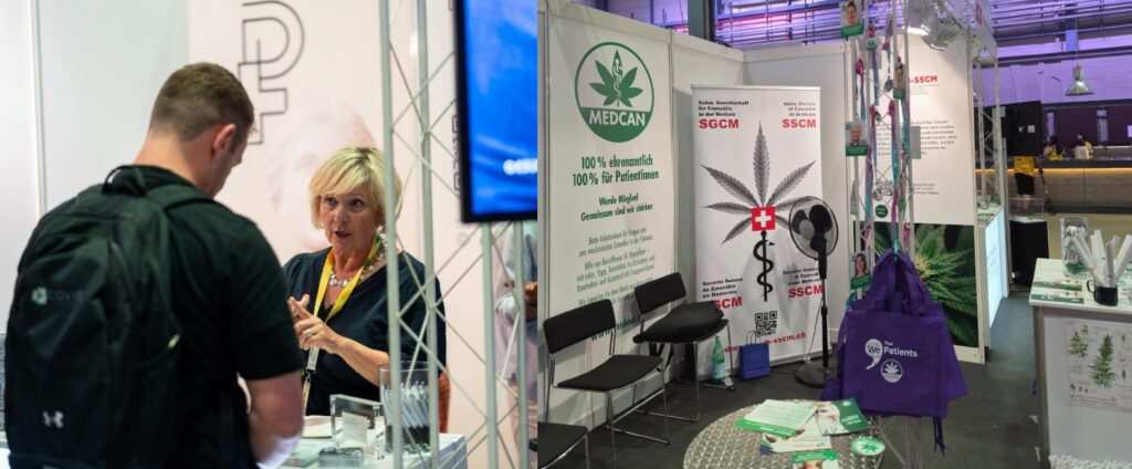 MEDCAN医療用大麻ブースで、ブロンドの女性スタッフがバックパックを背負った男性来場者と会話している様子。背景にMEDCANロゴ、SGCM・SSCMのバナー、患者支援の紫のトートバッグが見える医療用大麻展示ブース。